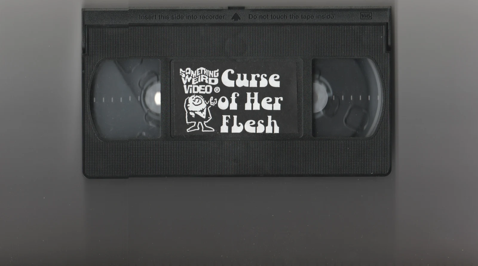 The Curse of Her Flesh VHS front label scan