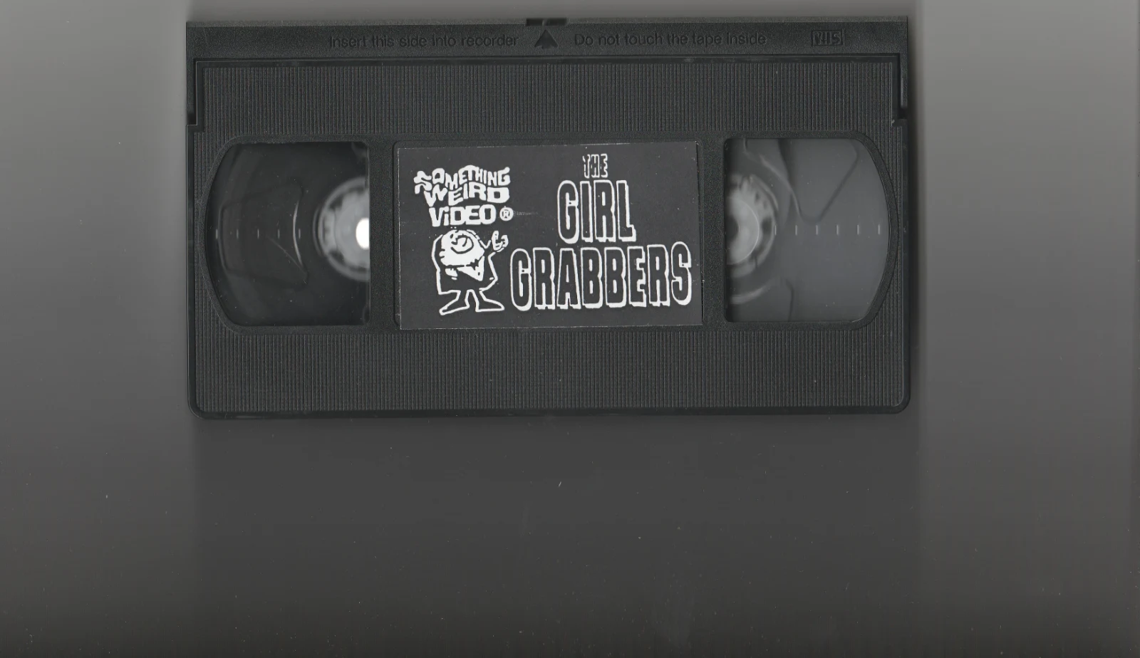 The Girl Grabbers VHS front label scan